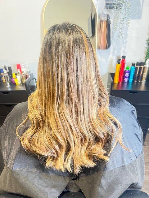 Blonde balayage with loose curls