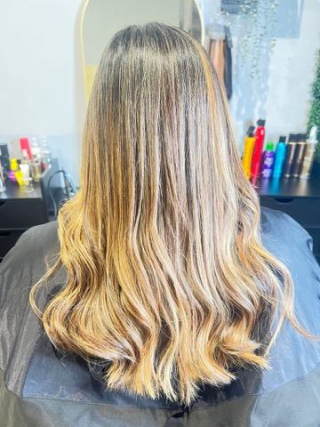 Long blonde balayage, finished and styled